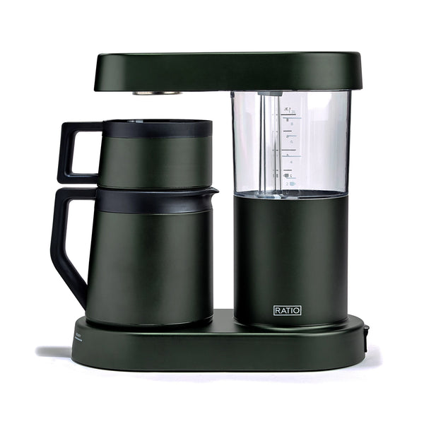 A dark forest green coffee maker with a matching carafe and base, featuring a clear water reservoir and a small visible RATIO logo on the front, set against a plain white background.