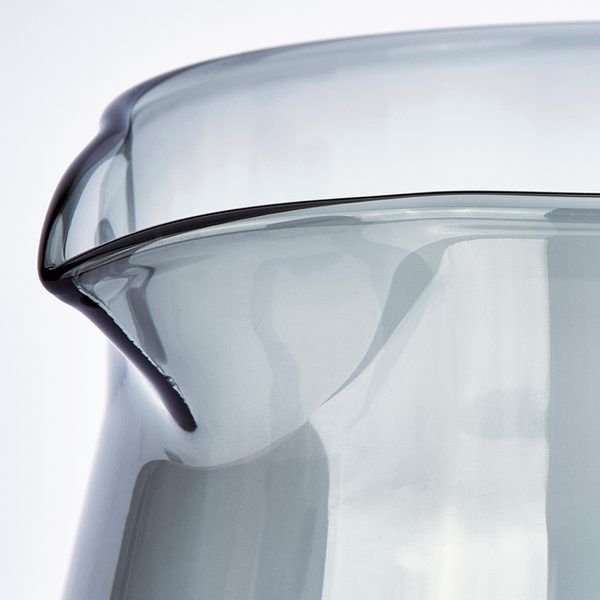 Hand-blown borosilicate glass carafe.